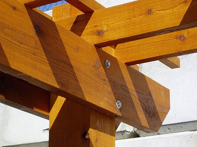 Close-up detail view of the joinery on a custom wooden pergola